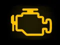 Spia motore accesa ma la macchina va bene. Icona gialla stilizzata di un motore su sfondo nero.