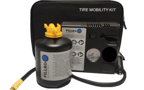 Kit di riparazione pneumatici: una bombola sigillante e un compressore per gonfiare e riparare la gomma in caso di emergenza.