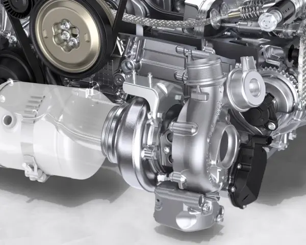 Dettaglio di un motore con un componente turbo lucido al centro, pronto a sprigionare potenza.